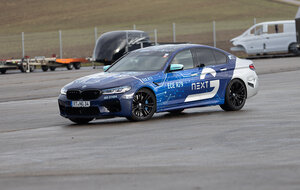 A BMW M5 in Arnold NextG design, equipped with NX NextMotion force feedback technology, is tested on a proving ground by development driver Bruno Spengler.